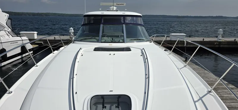  Yacht Photos Pics 2008 Sea Ray 44 Sundancer yacht docked at a marina, viewed from the bow.