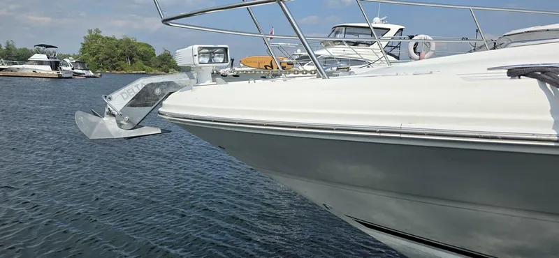  Yacht Photos Pics 2008 Sea Ray 44 Sundancer yacht anchored in a serene marina setting.