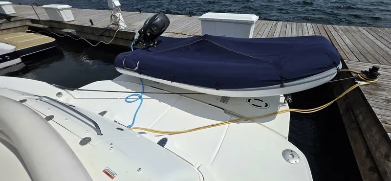  Yacht Photos Pics 2008 Sea Ray 44 Sundancer docked with covered dinghy on deck.