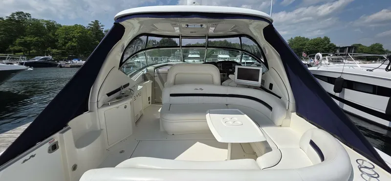  Yacht Photos Pics 2008 Sea Ray 44 Sundancer yacht interior with seating and table, docked at marina.