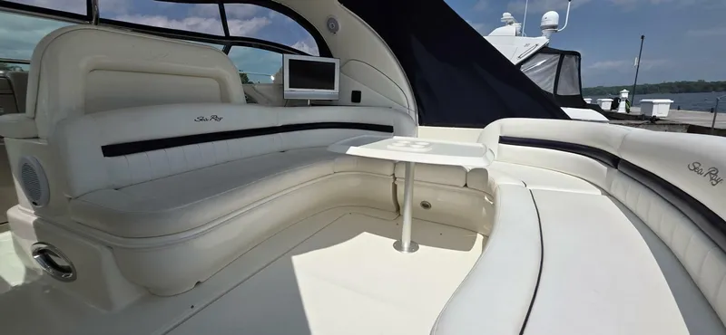  Yacht Photos Pics Luxurious 2008 Sea Ray 44 Sundancer yacht interior with plush seating and a small table.
