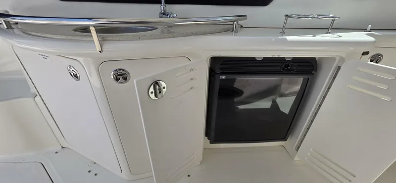  Yacht Photos Pics 2008 Sea Ray 44 Sundancer yacht kitchenette with sink and mini fridge.