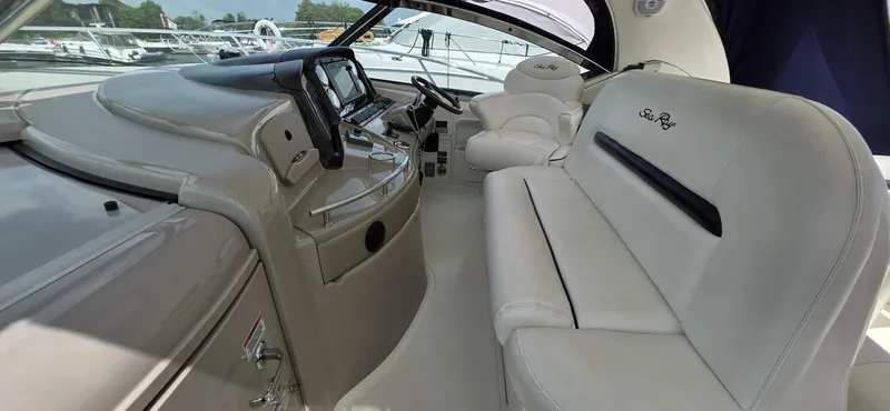  Yacht Photos Pics 2008 Sea Ray 44 Sundancer cockpit with luxurious seating and modern controls.