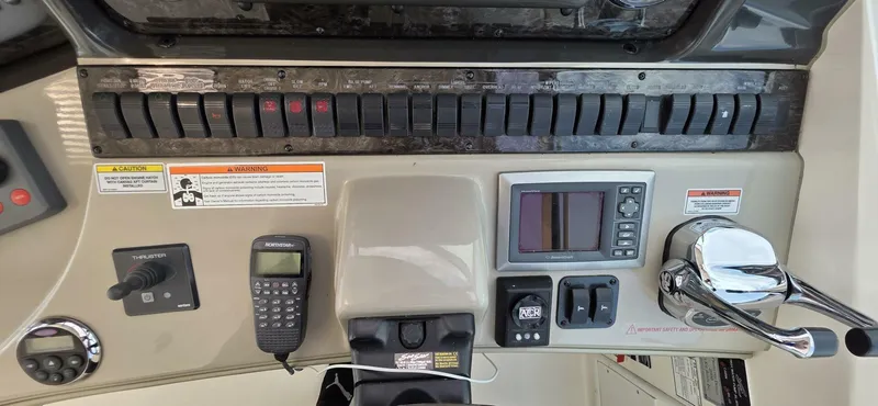  Yacht Photos Pics Control panel of 2008 Sea Ray 44 Sundancer boat with switches and navigation equipment.
