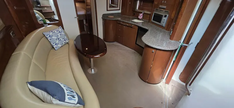  Yacht Photos Pics Interior of 2008 Sea Ray 44 Sundancer yacht with kitchen and seating area.