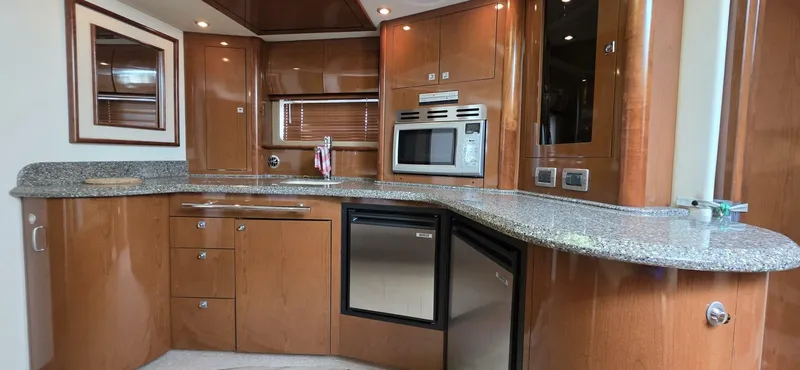  Yacht Photos Pics Luxurious kitchen interior of 2008 Sea Ray 44 Sundancer yacht with modern appliances.