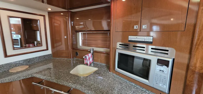  Yacht Photos Pics Luxurious kitchen interior of 2008 Sea Ray 44 Sundancer yacht with modern appliances.