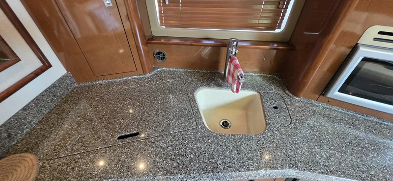  Yacht Photos Pics 2008 Sea Ray 44 Sundancer kitchen with granite countertop and sink.