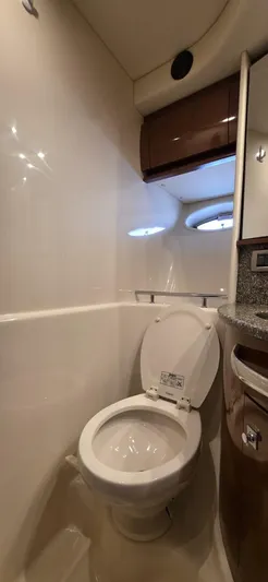  Yacht Photos Pics 2008 Sea Ray 44 Sundancer yacht bathroom with toilet and porthole window.