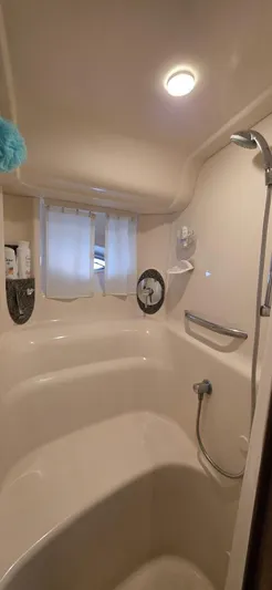  Yacht Photos Pics Bathroom interior of 2008 Sea Ray 44 Sundancer yacht with shower and curtain.