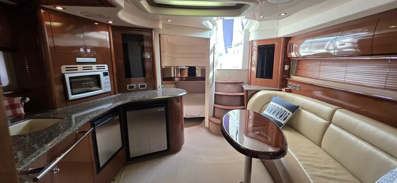  Yacht Photos Pics Luxurious interior of 2008 Sea Ray 44 Sundancer yacht with modern kitchen and seating area.