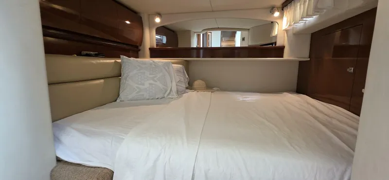  Yacht Photos Pics Luxurious cabin interior of 2008 Sea Ray 44 Sundancer yacht with cozy bedding.