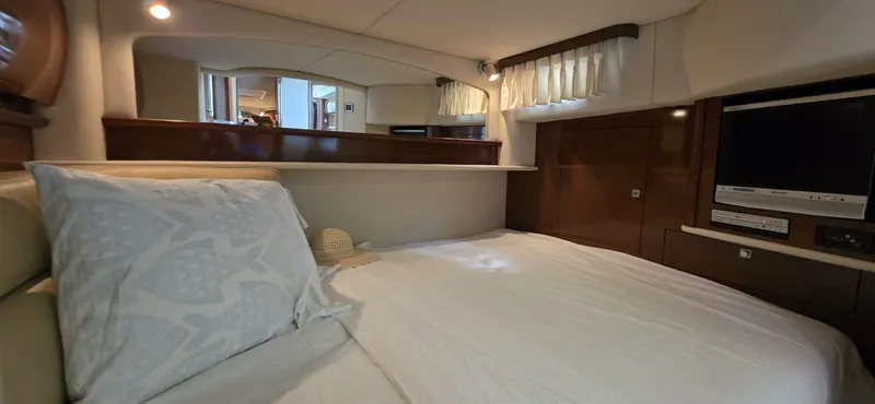  Yacht Photos Pics Luxurious cabin interior of 2008 Sea Ray 44 Sundancer yacht with cozy bed and TV.