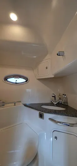  Yacht Photos Pics 2008 Sea Ray 44 Sundancer yacht bathroom with modern fixtures and porthole window.