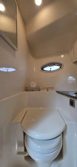  Yacht Photos Pics 2008 Sea Ray 44 Sundancer yacht bathroom with modern fixtures and porthole window.