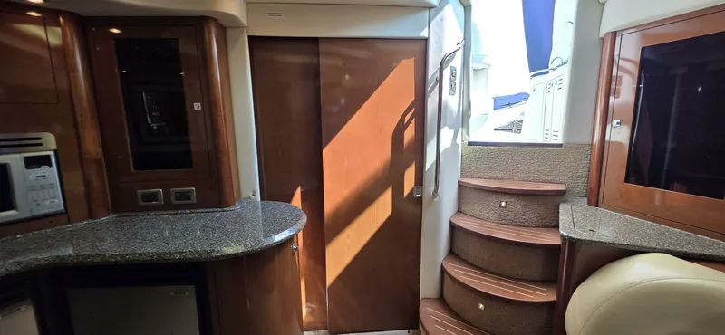  Yacht Photos Pics Interior of 2008 Sea Ray 44 Sundancer yacht with stairs and modern kitchen area.