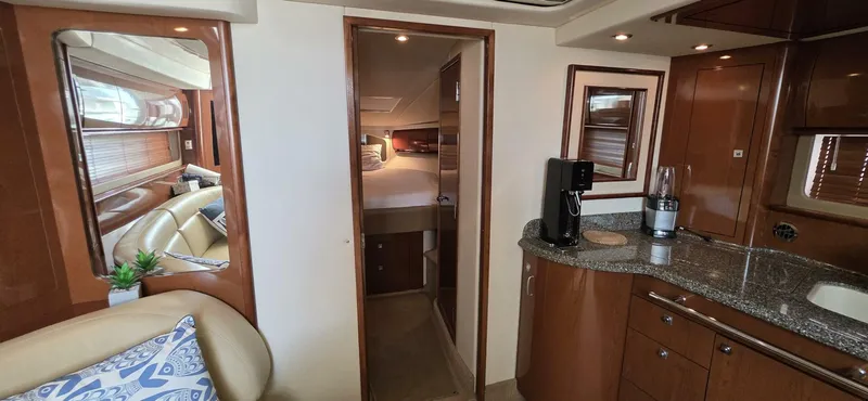  Yacht Photos Pics Interior of 2008 Sea Ray 44 Sundancer yacht with modern kitchen and cozy bedroom.