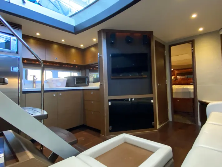  Yacht Photos Pics Luxurious interior of 2015 Sea Ray 510 Sundancer yacht with modern kitchen and entertainment area.