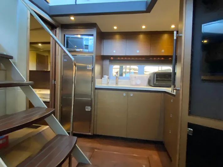  Yacht Photos Pics Luxurious 2015 Sea Ray 510 Sundancer yacht interior with modern kitchen and staircase.