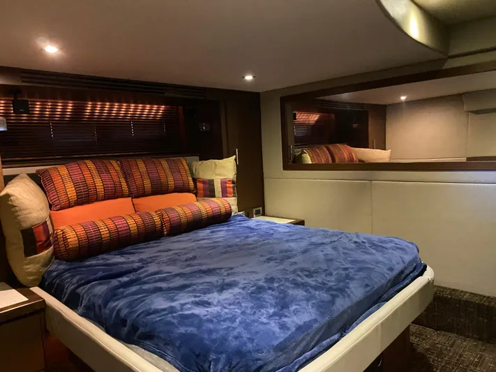  Yacht Photos Pics Luxurious bedroom interior of 2015 Sea Ray 510 Sundancer yacht with plush bedding.