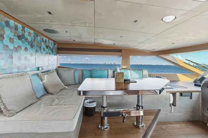 Wild Duck Yacht Photos Pics Luxurious Horizon RP110 yacht interior with ocean view, featuring elegant seating and modern decor.