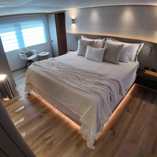  Yacht Photos Pics Luxurious bedroom interior on Inace AVENTURA 106 yacht, 2027 model, featuring elegant lighting and modern design.