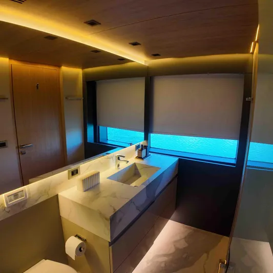  Yacht Photos Pics Luxurious bathroom interior on Inace AVENTURA 106 yacht, featuring modern design and ambient lighting.