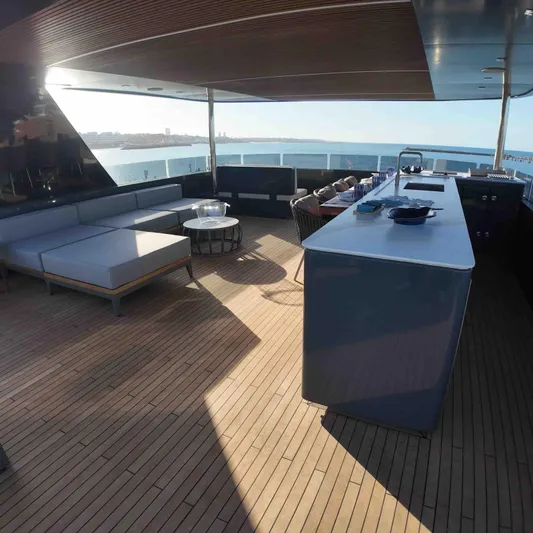  Yacht Photos Pics Luxurious deck of 2027 Inace AVENTURA 106 yacht with modern seating and ocean view.