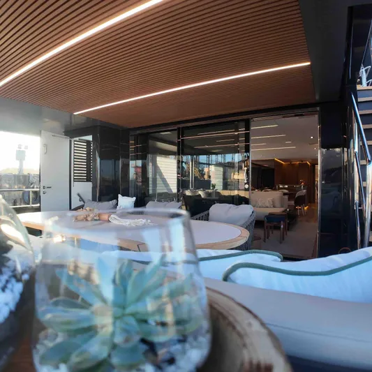 Yacht Photos Pics Luxurious interior of 2027 Inace AVENTURA 106 yacht with modern decor and seating area.