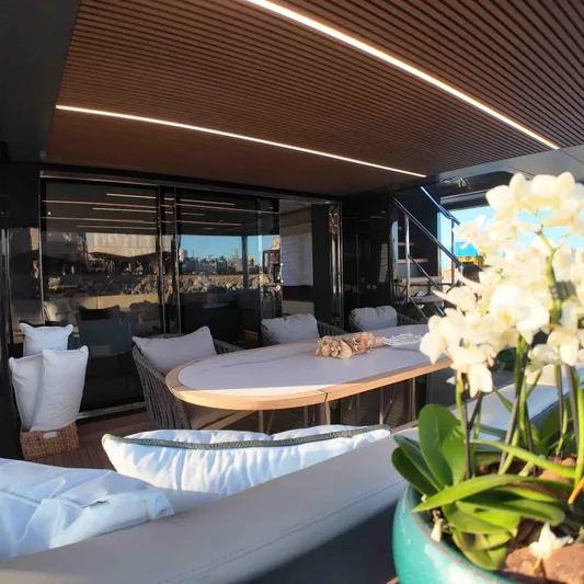  Yacht Photos Pics Luxurious Inace AVENTURA 106 yacht interior, featuring elegant seating and floral decor, 2027 model.