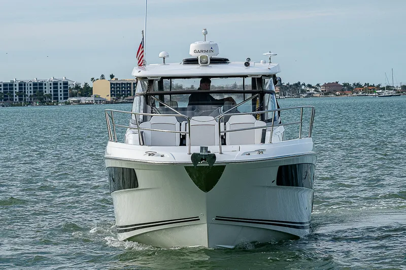 Brama Sole Yacht Photos Pics 2022 Jeanneau Leader 12.5 boat cruising on water, front view.