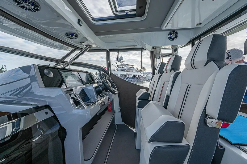 Brama Sole Yacht Photos Pics Interior of 2022 Jeanneau Leader 12.5 boat with modern seating and dashboard.
