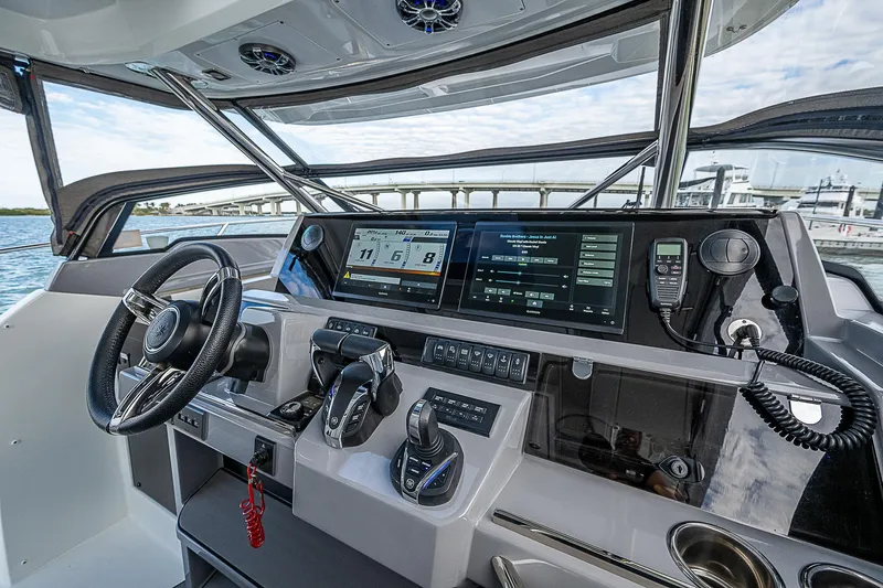 Brama Sole Yacht Photos Pics 2022 Jeanneau Leader 12.5 cockpit with advanced navigation controls and sleek design.