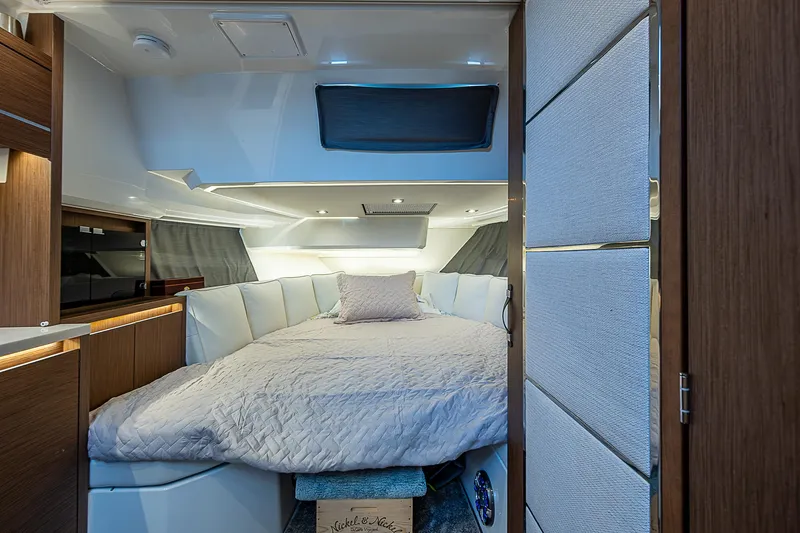 Brama Sole Yacht Photos Pics Interior cabin of 2022 Jeanneau Leader 12.5 yacht with cozy bed and modern design.