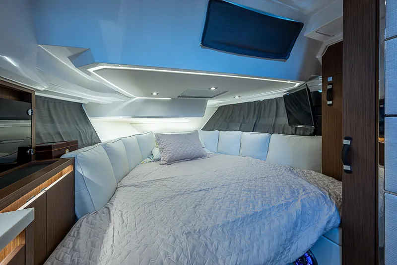 Brama Sole Yacht Photos Pics Luxurious cabin interior of 2022 Jeanneau Leader 12.5 with cozy bedding and modern design.