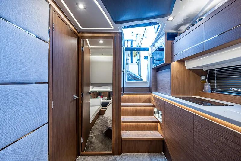 Brama Sole Yacht Photos Pics Interior of 2022 Jeanneau Leader 12.5 yacht, featuring modern wood finishes and sleek design.