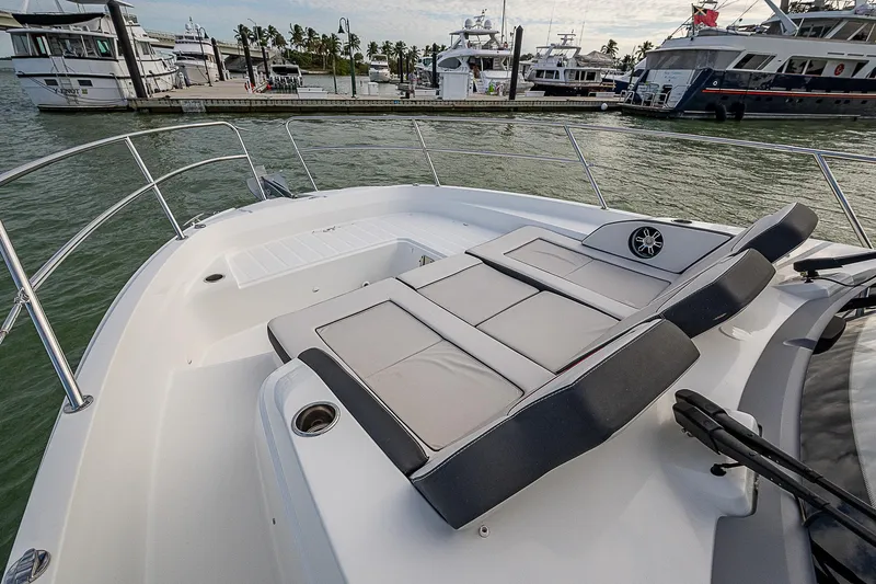 Brama Sole Yacht Photos Pics 2022 Jeanneau Leader 12.5 boat with sun loungers, docked at marina.