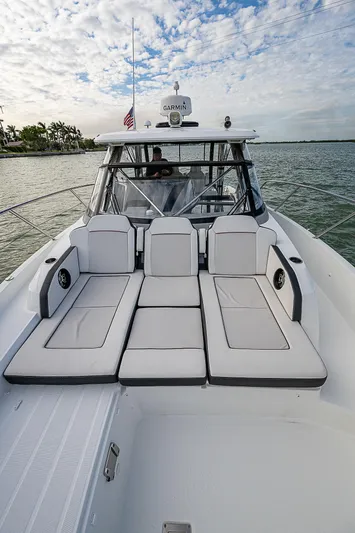 Brama Sole Yacht Photos Pics 2022 Jeanneau Leader 12.5 boat with spacious deck and seating, cruising on calm waters.