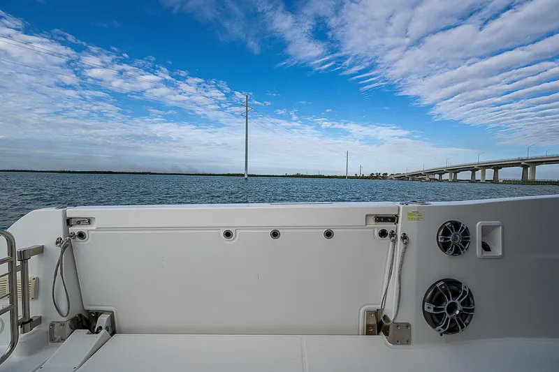 Brama Sole Yacht Photos Pics 2022 Jeanneau Leader 12.5 boat deck with scenic water and bridge view.