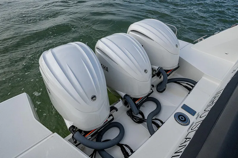 Brama Sole Yacht Photos Pics Triple Yamaha outboard engines on 2022 Jeanneau Leader 12.5 boat in water.
