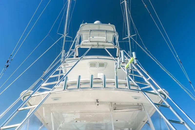 Ebtide Yacht Photos Pics 2006 Cabo 45 Express yacht tower against clear blue sky.