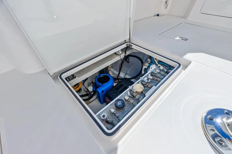Ebtide Yacht Photos Pics Open hatch of 2006 Cabo 45 Express boat showing internal components and wiring.