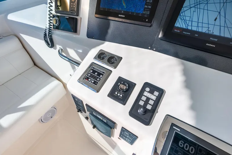 Ebtide Yacht Photos Pics Control panel of a 2006 Cabo 45 Express boat with navigation equipment.