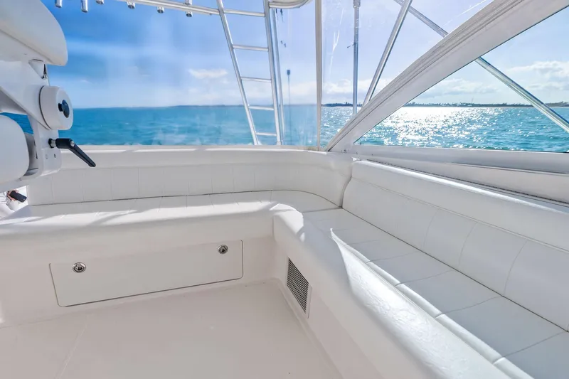 Ebtide Yacht Photos Pics Luxurious 2006 Cabo 45 Express yacht interior with ocean view and white seating.