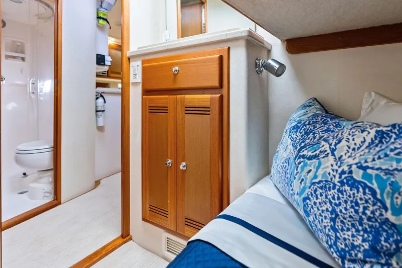 Ebtide Yacht Photos Pics Interior of 2006 Cabo 45 Express yacht with cozy cabin and bathroom.