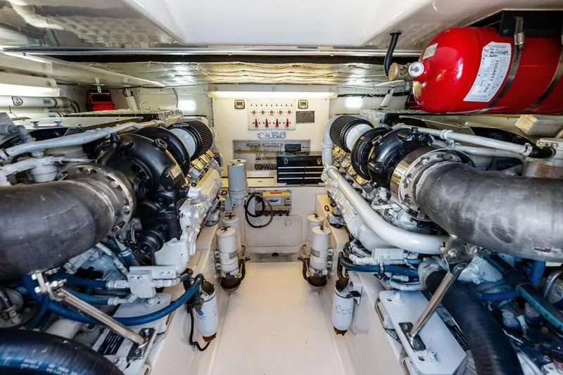 Ebtide Yacht Photos Pics Engine room of 2006 Cabo 45 Express yacht, featuring dual engines and fire suppression system.