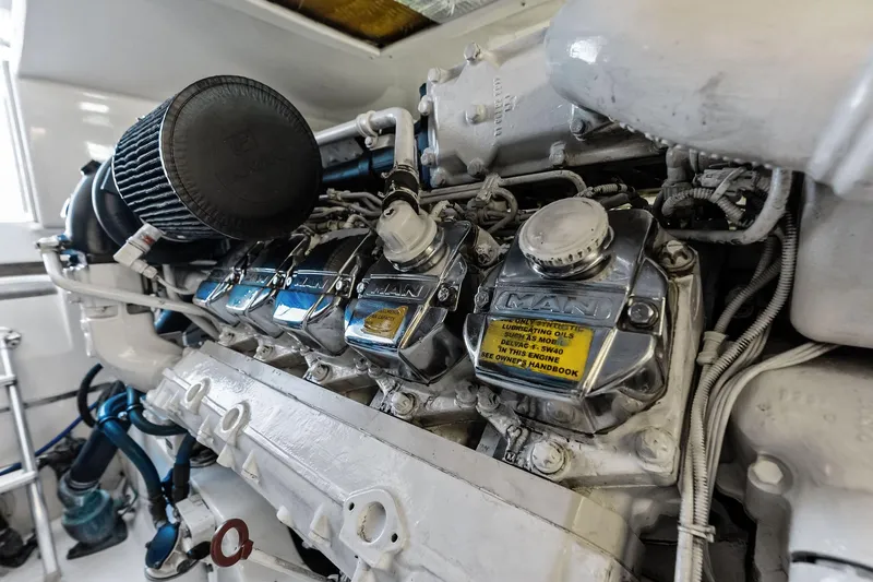 Ebtide Yacht Photos Pics Engine of 2006 Cabo 45 Express boat, featuring MAN components and detailed mechanical parts.