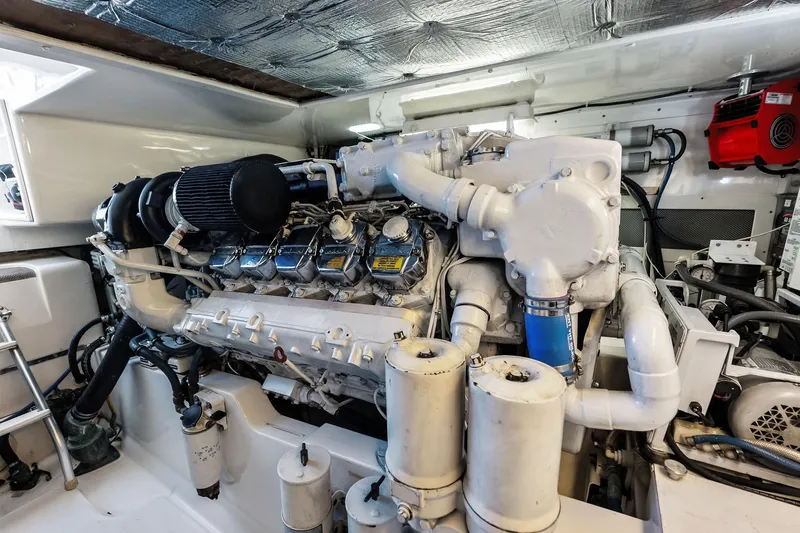 Ebtide Yacht Photos Pics Engine room of a 2006 Cabo 45 Express yacht, showcasing detailed machinery.