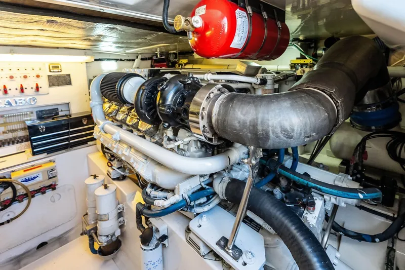 Ebtide Yacht Photos Pics Engine room of a 2006 Cabo 45 Express boat, featuring detailed mechanical components.