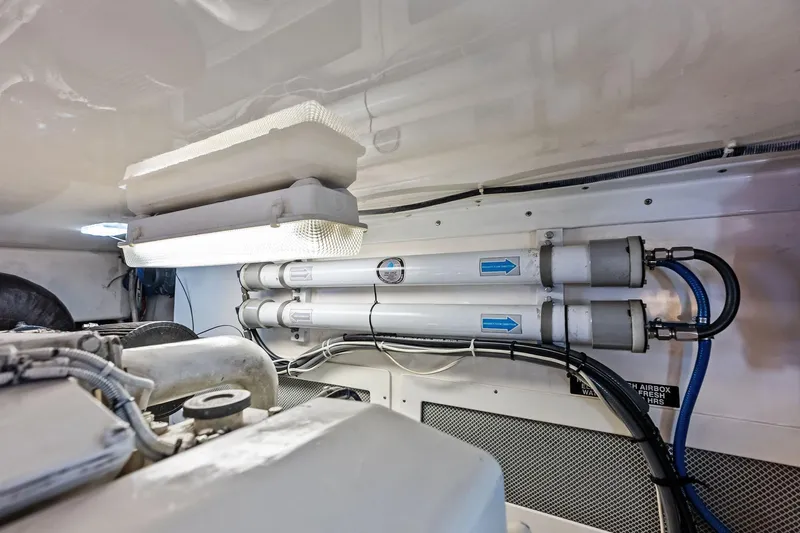 Ebtide Yacht Photos Pics Engine room of 2006 Cabo 45 Express yacht with water filtration system.